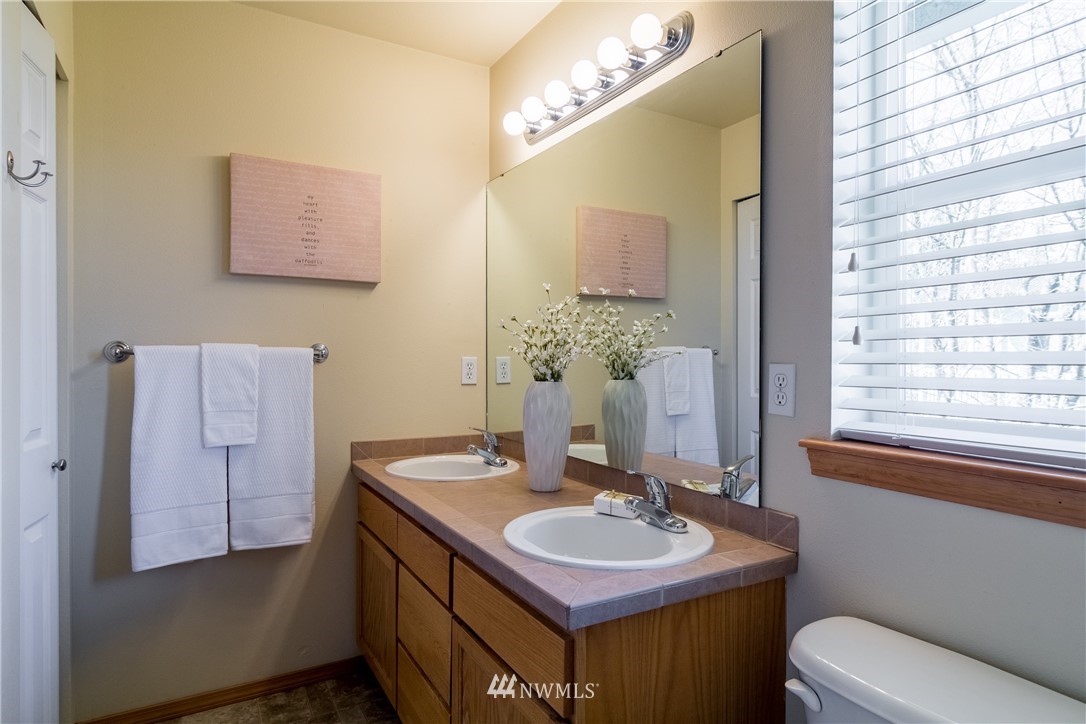 7432 Upper Ridge Road Everett, WA 98203 - Photo 18 of 32 a bathroom with a sink and a mirror