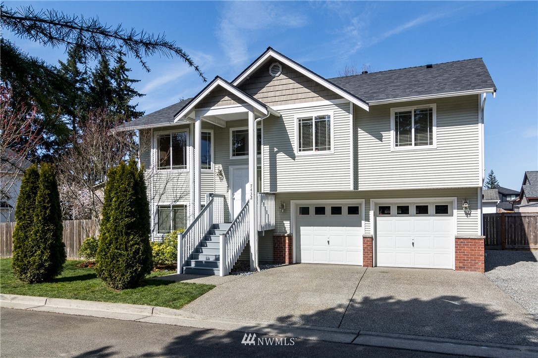 7432 Upper Ridge Road Everett, WA 98203 - Photo 30 of 32 a front view of a house with a yard