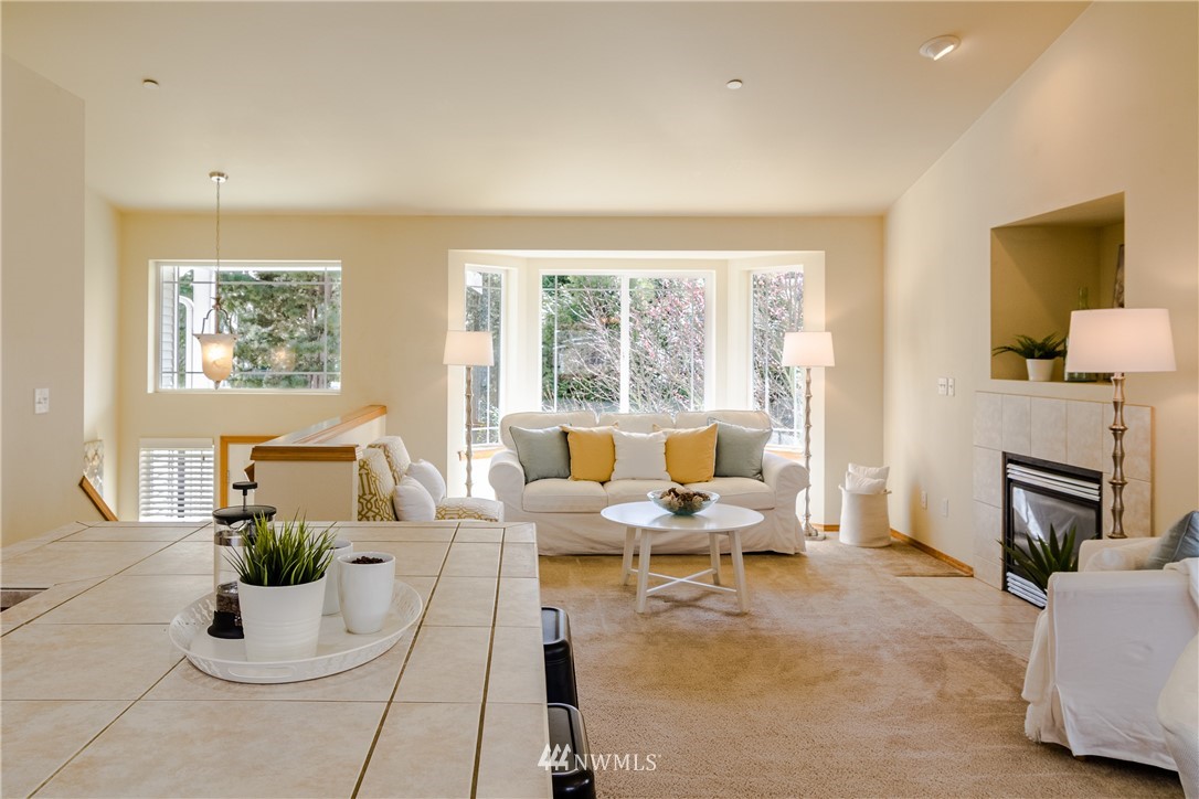 7432 Upper Ridge Road Everett, WA 98203 - Photo 6 of 32 a living room with furniture fireplace and a large window