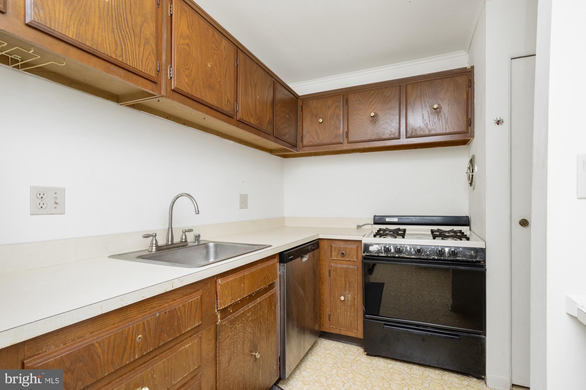 101 Fitz Court, Unit 202 Reisterstown, MD 21136 - Photo 15 of 27 a kitchen with stainless steel appliances granite countertop a sink a stove and cabinets