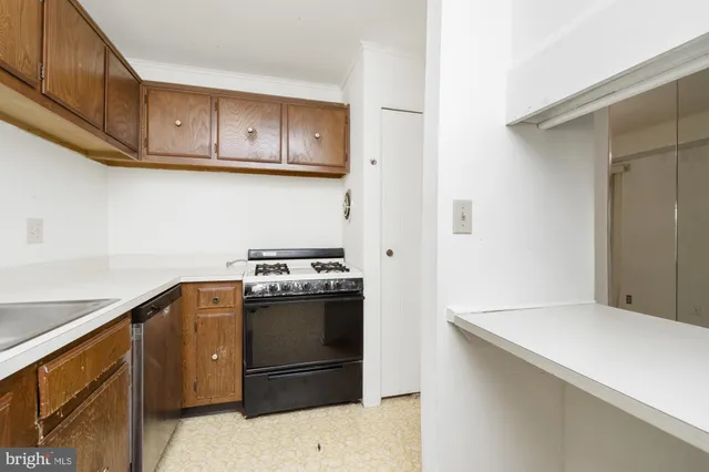a view of a hallway with washer and dryer