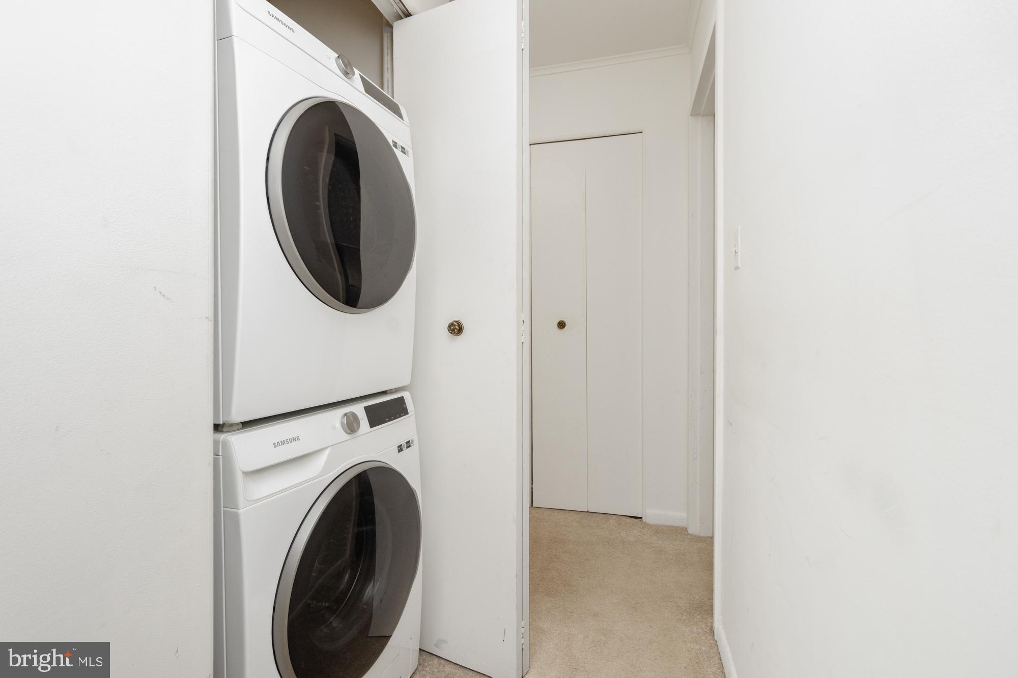 101 Fitz Court, Unit 202 Reisterstown, MD 21136 - Photo 17 of 27 a view of a hallway with washer and dryer