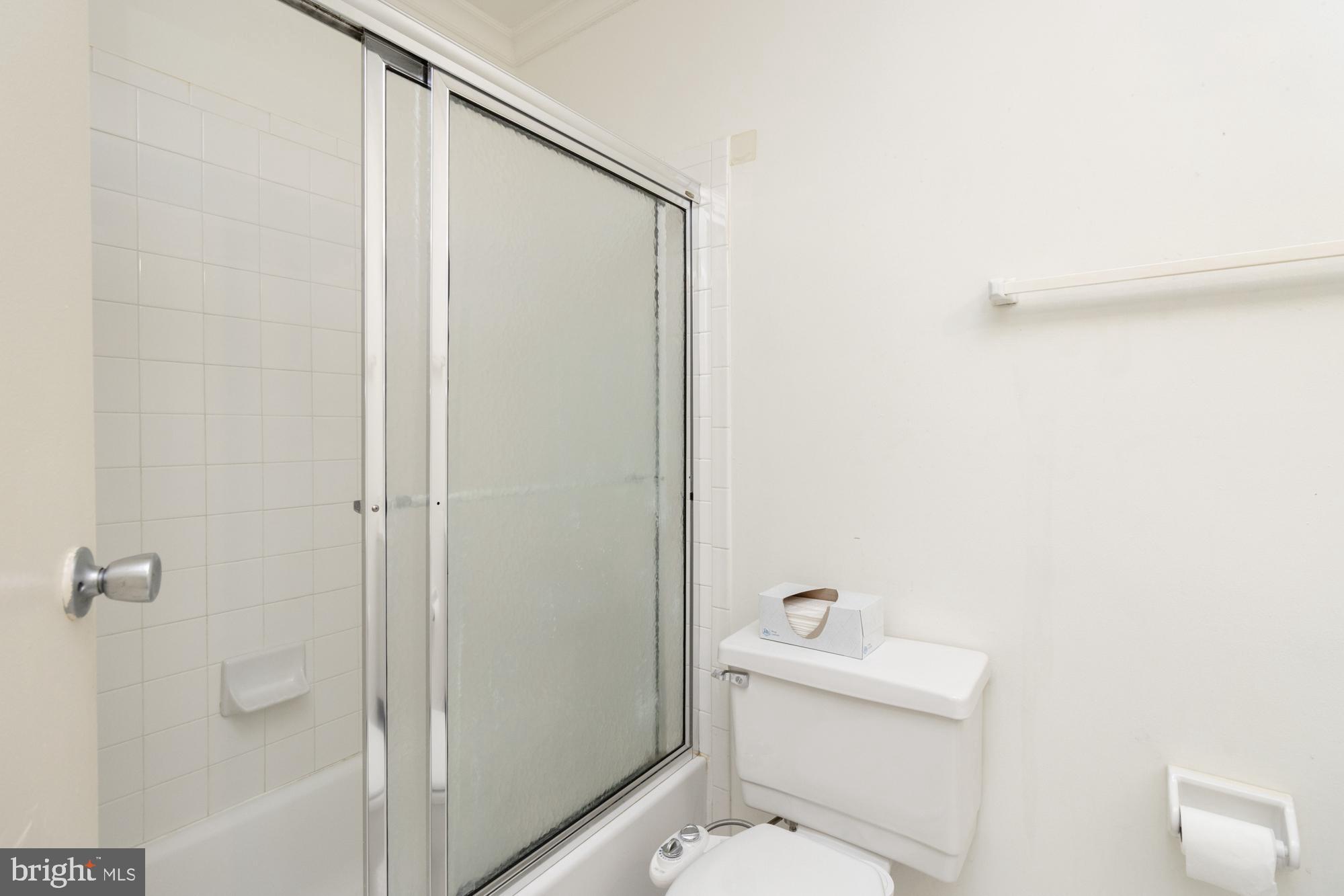 101 Fitz Court, Unit 202 Reisterstown, MD 21136 - Photo 19 of 27 a white toilet sitting next to a shower