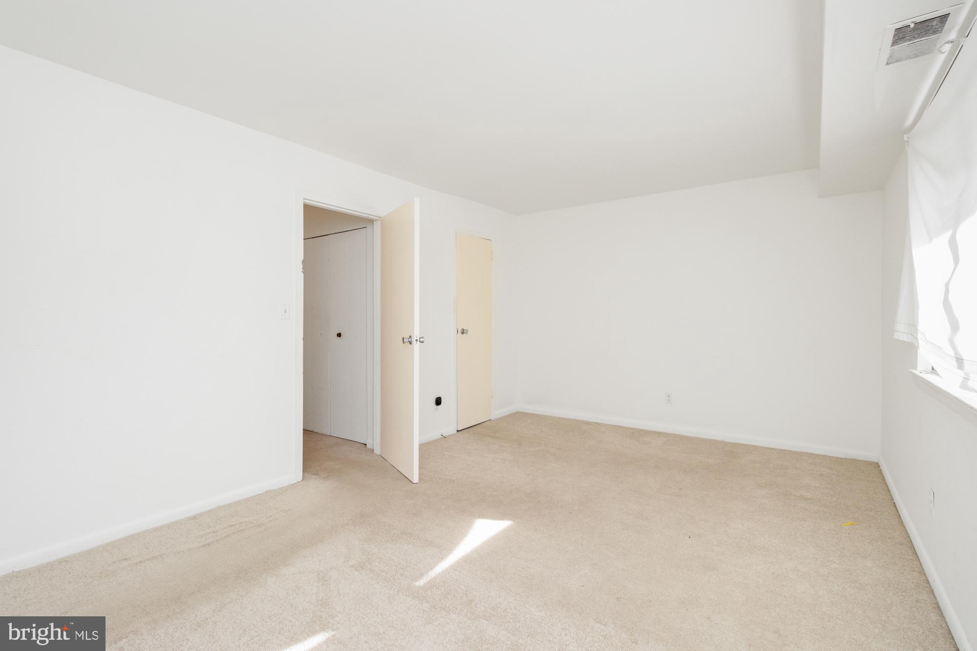 101 Fitz Court, Unit 202 Reisterstown, MD 21136 - Photo 21 of 27 an empty room with windows
