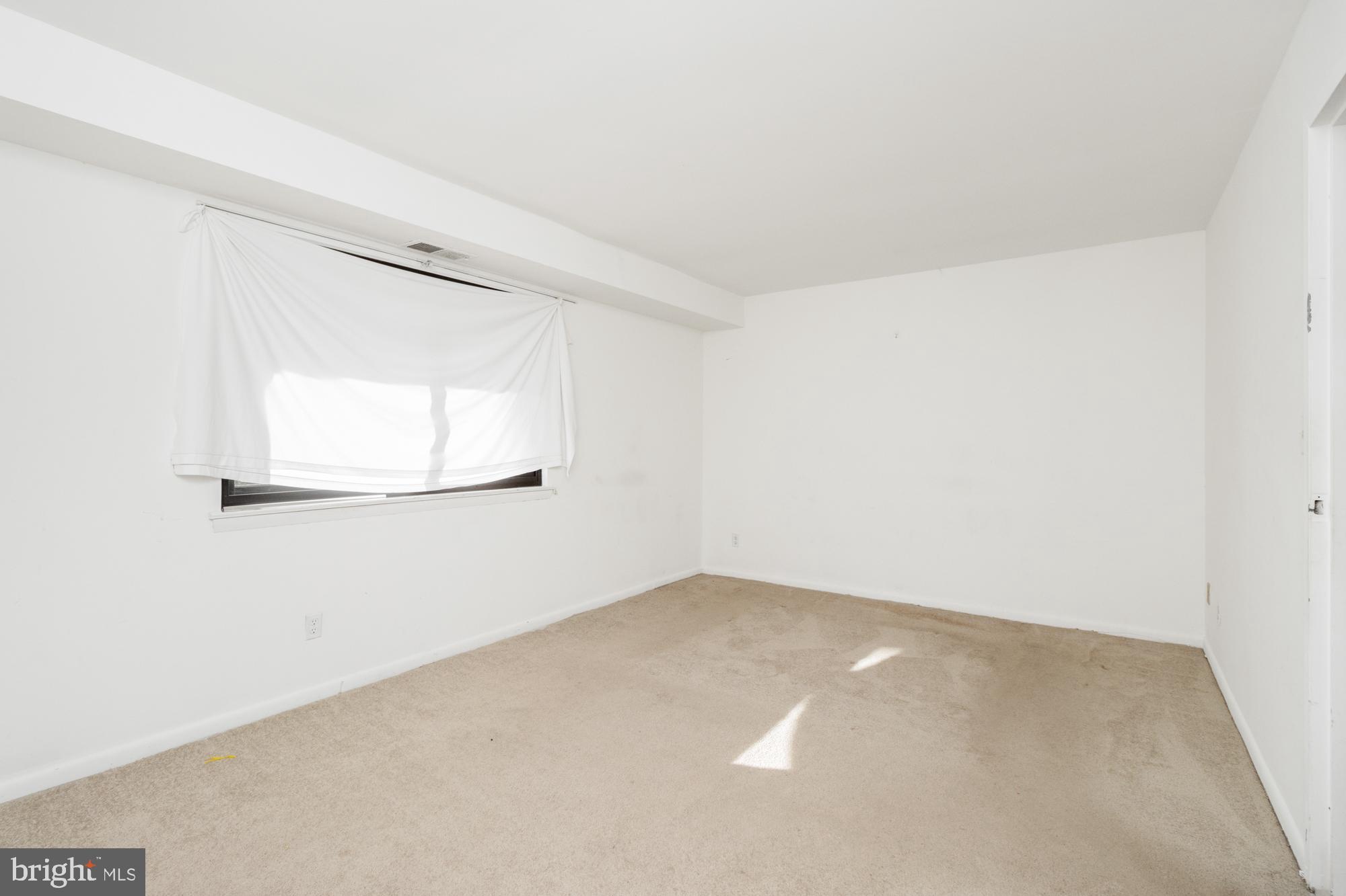 101 Fitz Court, Unit 202 Reisterstown, MD 21136 - Photo 22 of 27 an empty room with a window