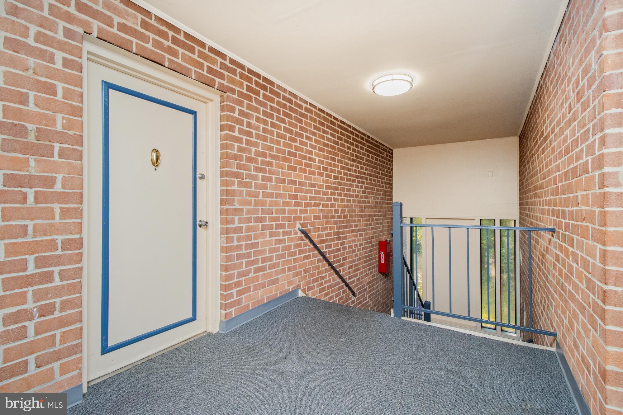 101 Fitz Court, Unit 202 Reisterstown, MD 21136 - Photo 27 of 27 a view of a hallway with wooden walls