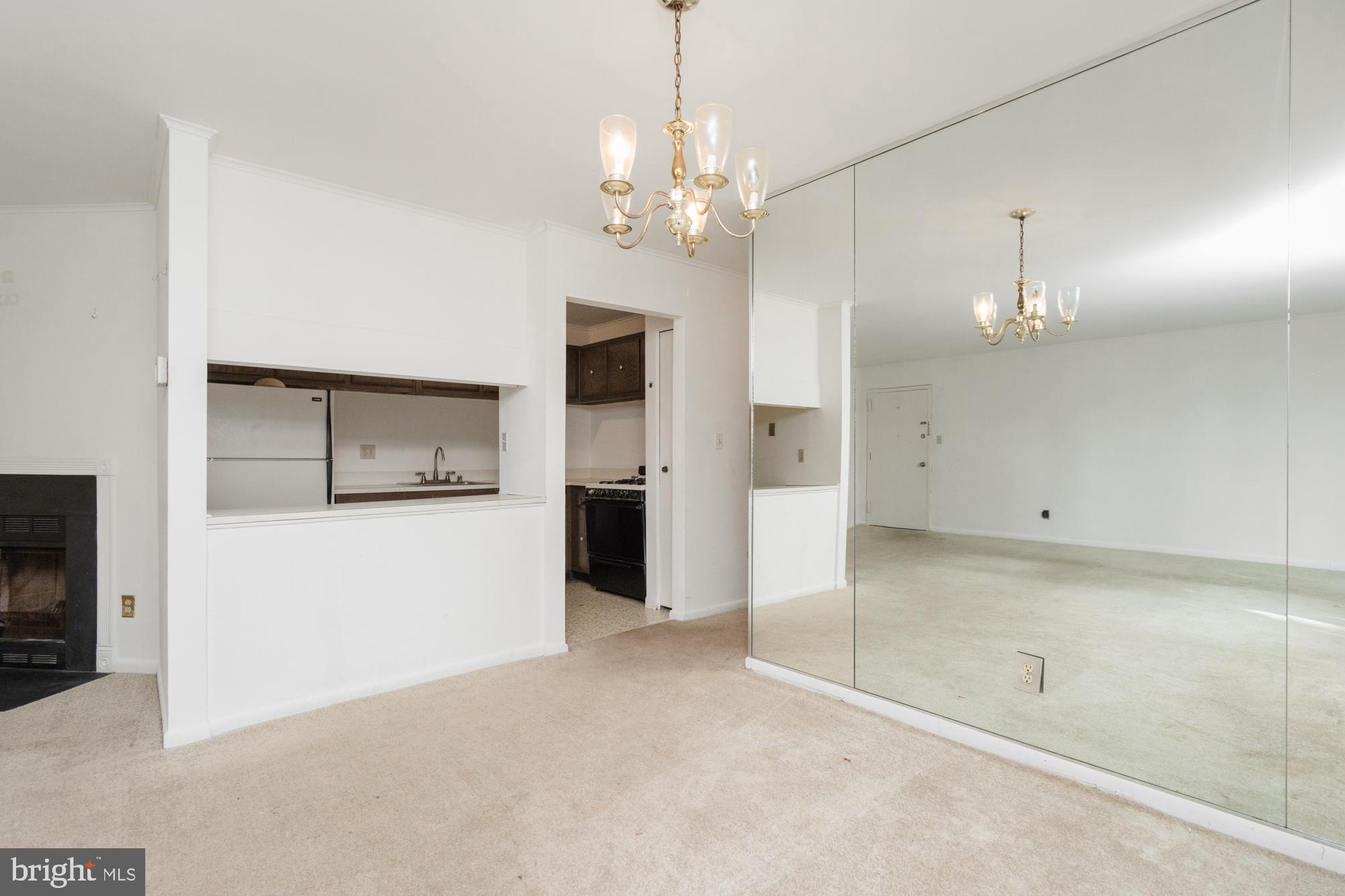 101 Fitz Court, Unit 202 Reisterstown, MD 21136 - Photo 9 of 27 a view of a kitchen with a sink and a refrigerator