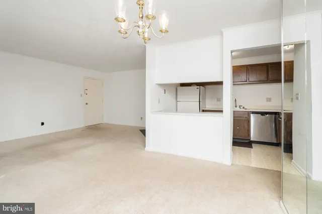 a view of a kitchen with a sink and dishwasher