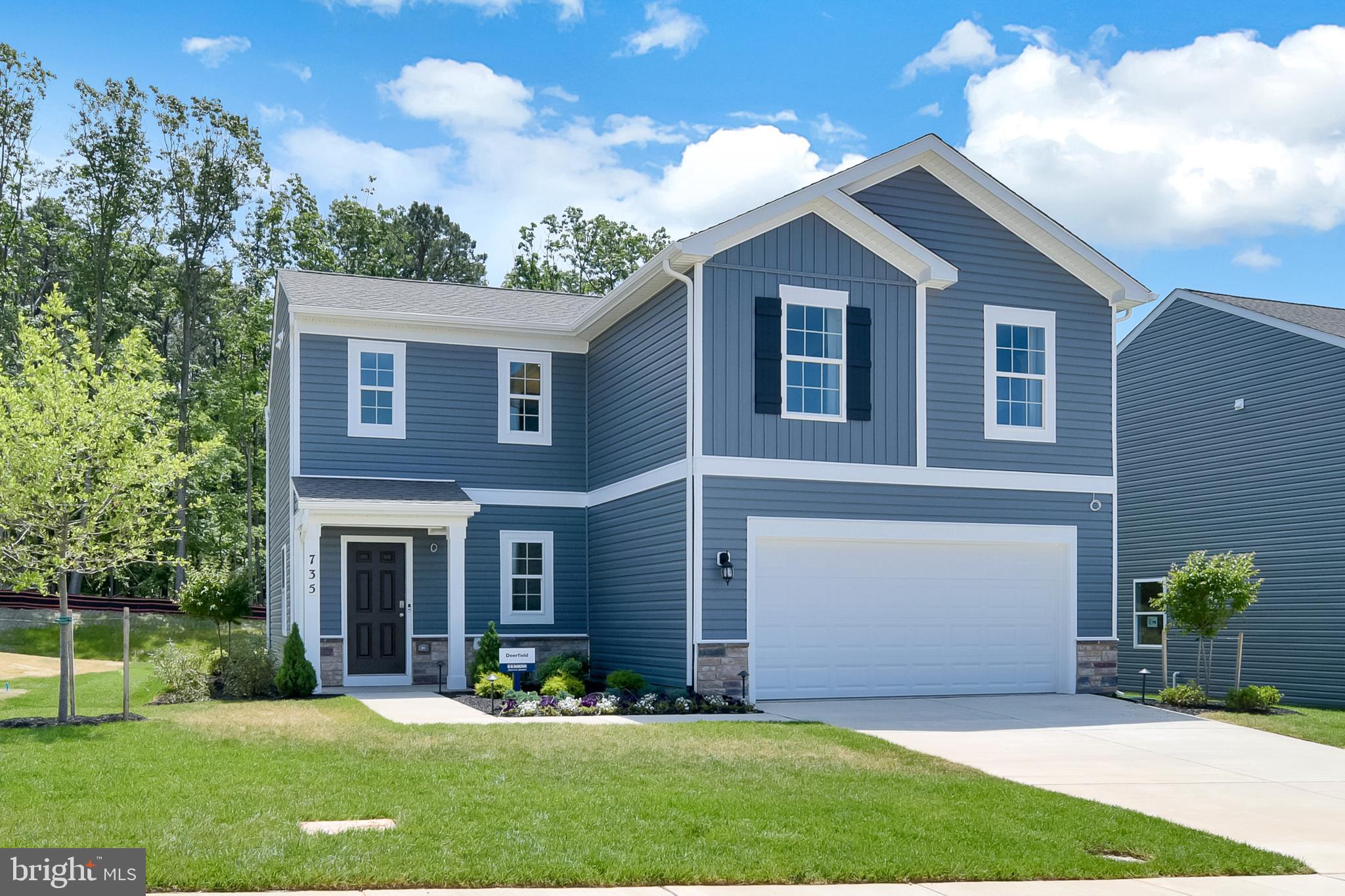 978 Pagonia Road Joppa, MD 21085 - Photo 1 of 34 a front view of a house with a yard and garage
