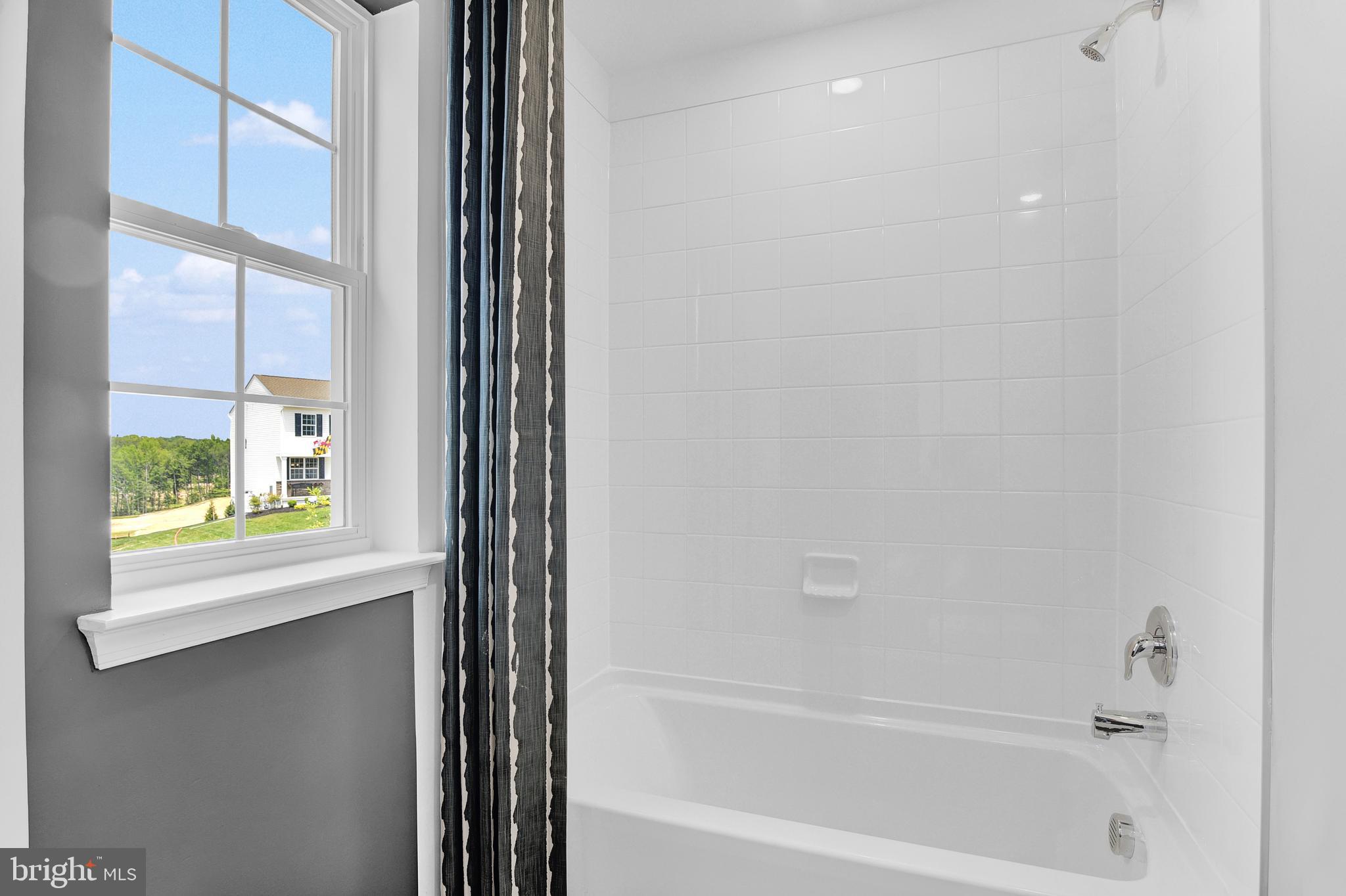 978 Pagonia Road Joppa, MD 21085 - Photo 31 of 34 a bathroom with a bathtub and a shower