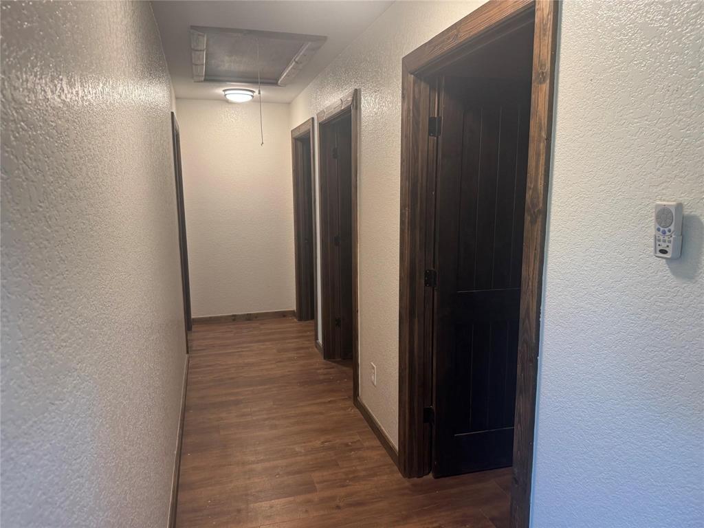 377 Private Road 3249, Unit ARENA Decatur, TX 76234 - Photo 29 of 40 a view of a bathroom with wooden floor