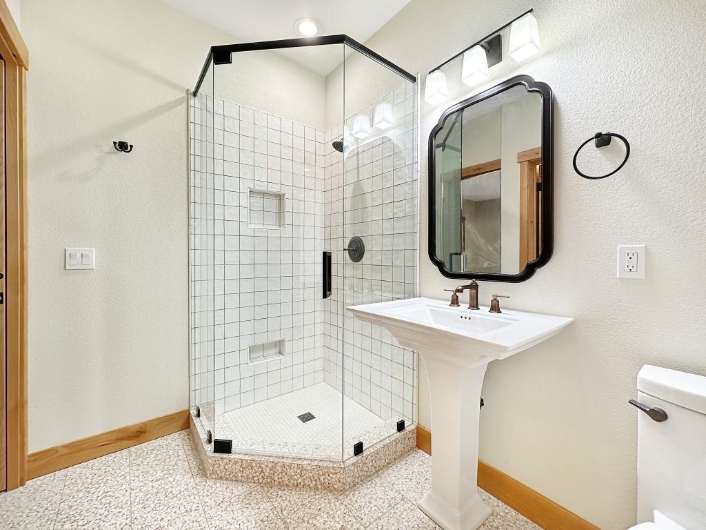 1025 Carmichael Road Clio, CA 96106 - Photo 11 of 21 a bathroom with a sink a mirror and shower