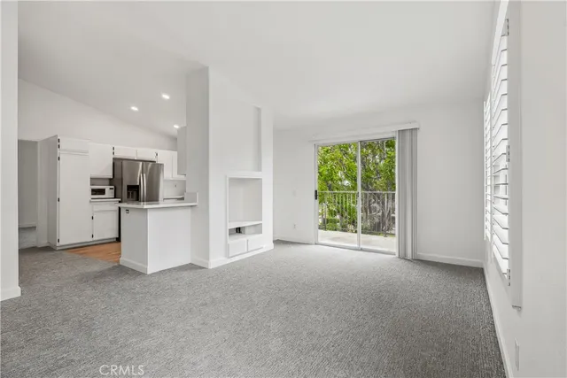 a view of a kitchen with refrigerator a sink and dishwasher