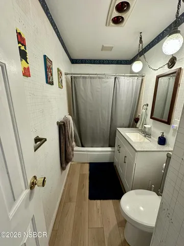 a room with furniture and a flat screen tv