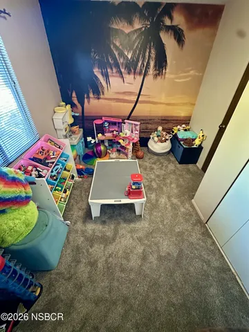 a view of entryway with a table and chairs