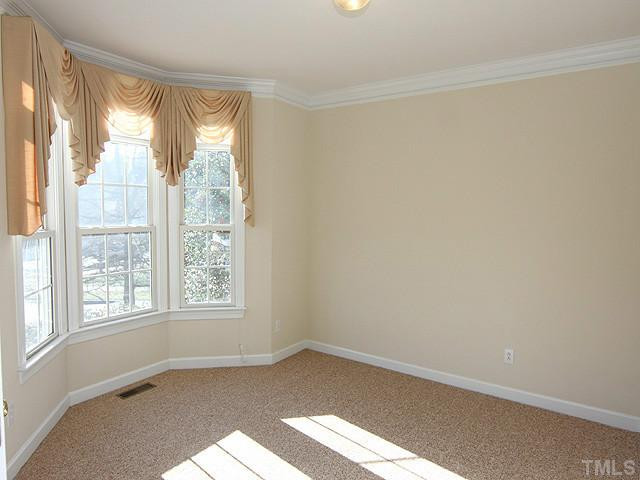 LR or office with bay window, crown molding, and French doors. Living Room