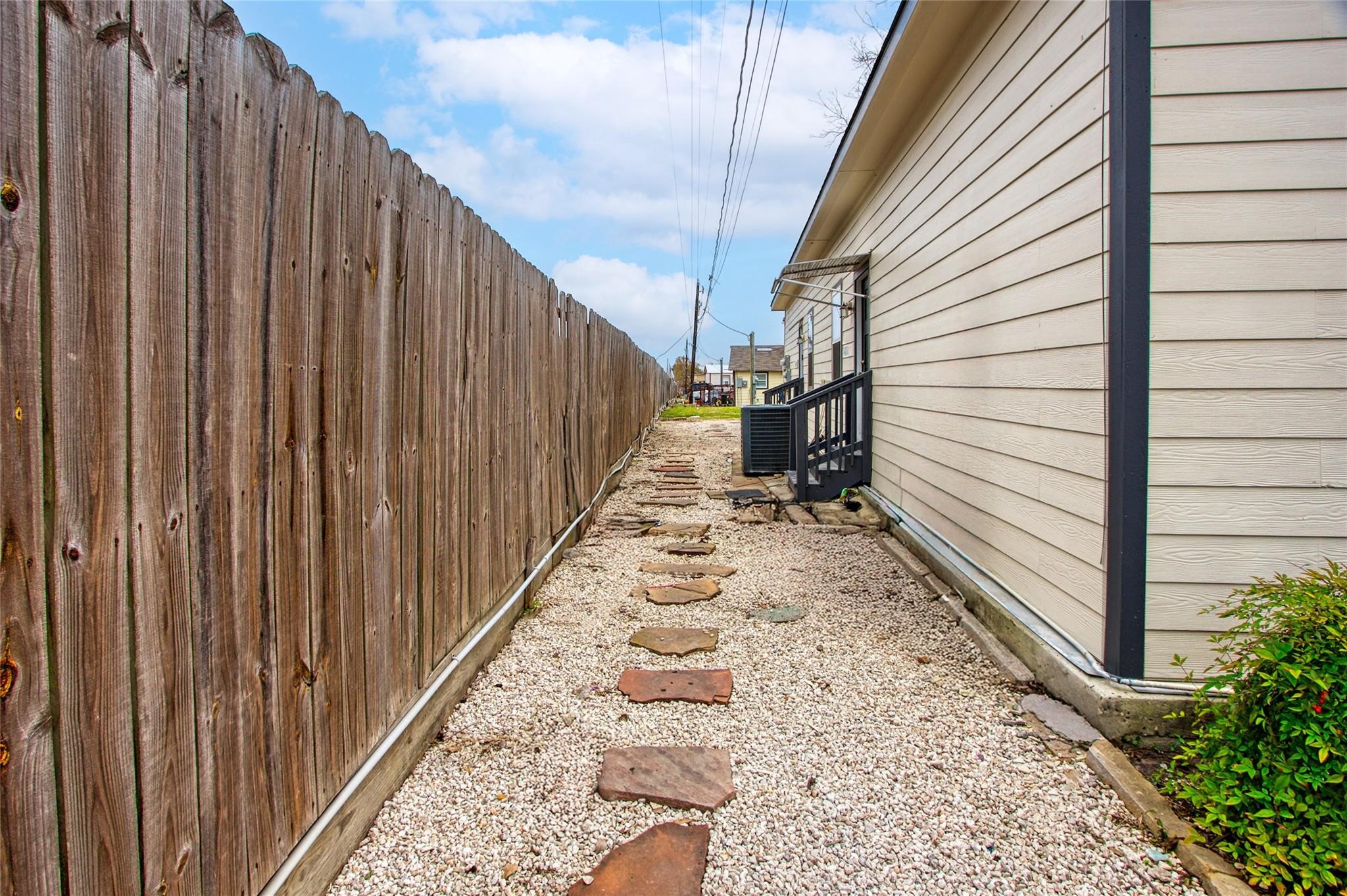 14310 Sweeney Road Houston, TX 77060 - Photo 14 of 14 a view of a pathway of a house with wooden floor