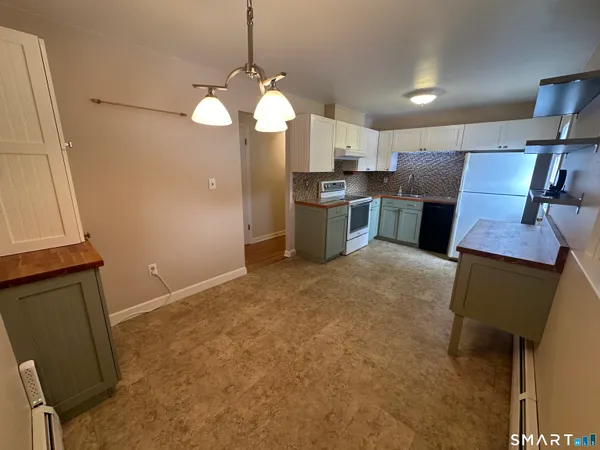 a view of cabinets and wooden floor