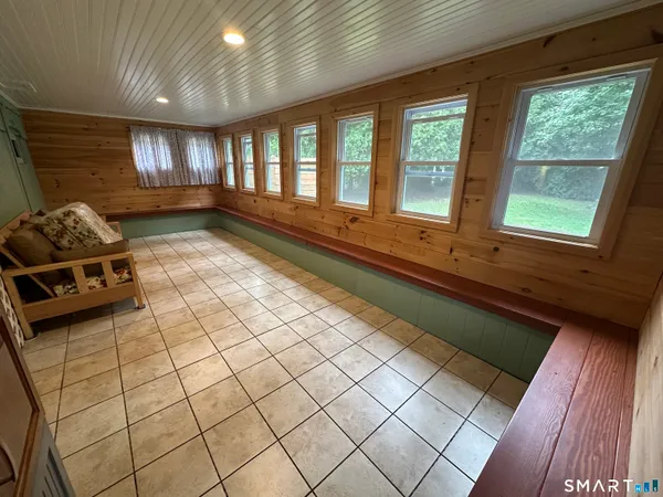a room with gym equipment and a large window