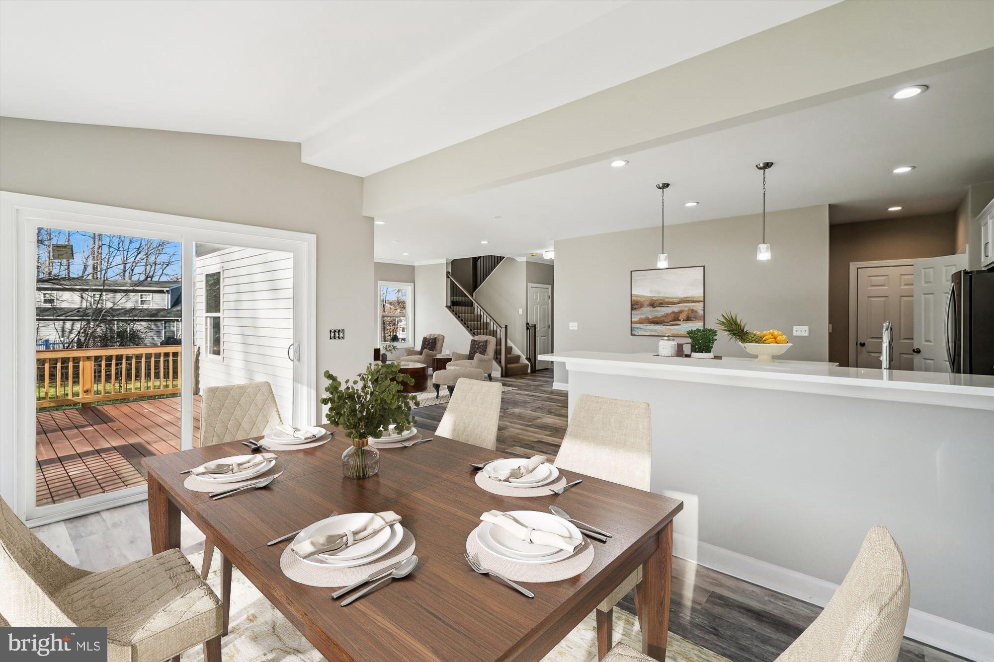 292 Colebrook Road Fredericksburg, VA 22405 - Photo 12 of 67 a view of a dining room with furniture a kitchen and chandelier