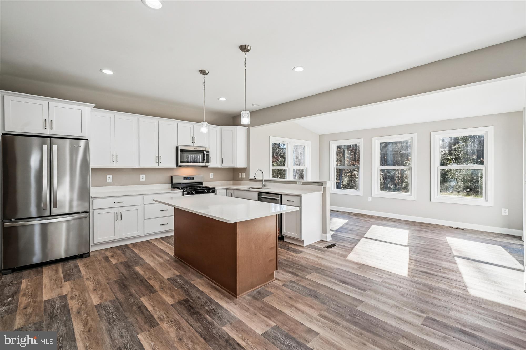 292 Colebrook Road Fredericksburg, VA 22405 - Photo 16 of 67 a kitchen with white cabinets and stainless steel appliances