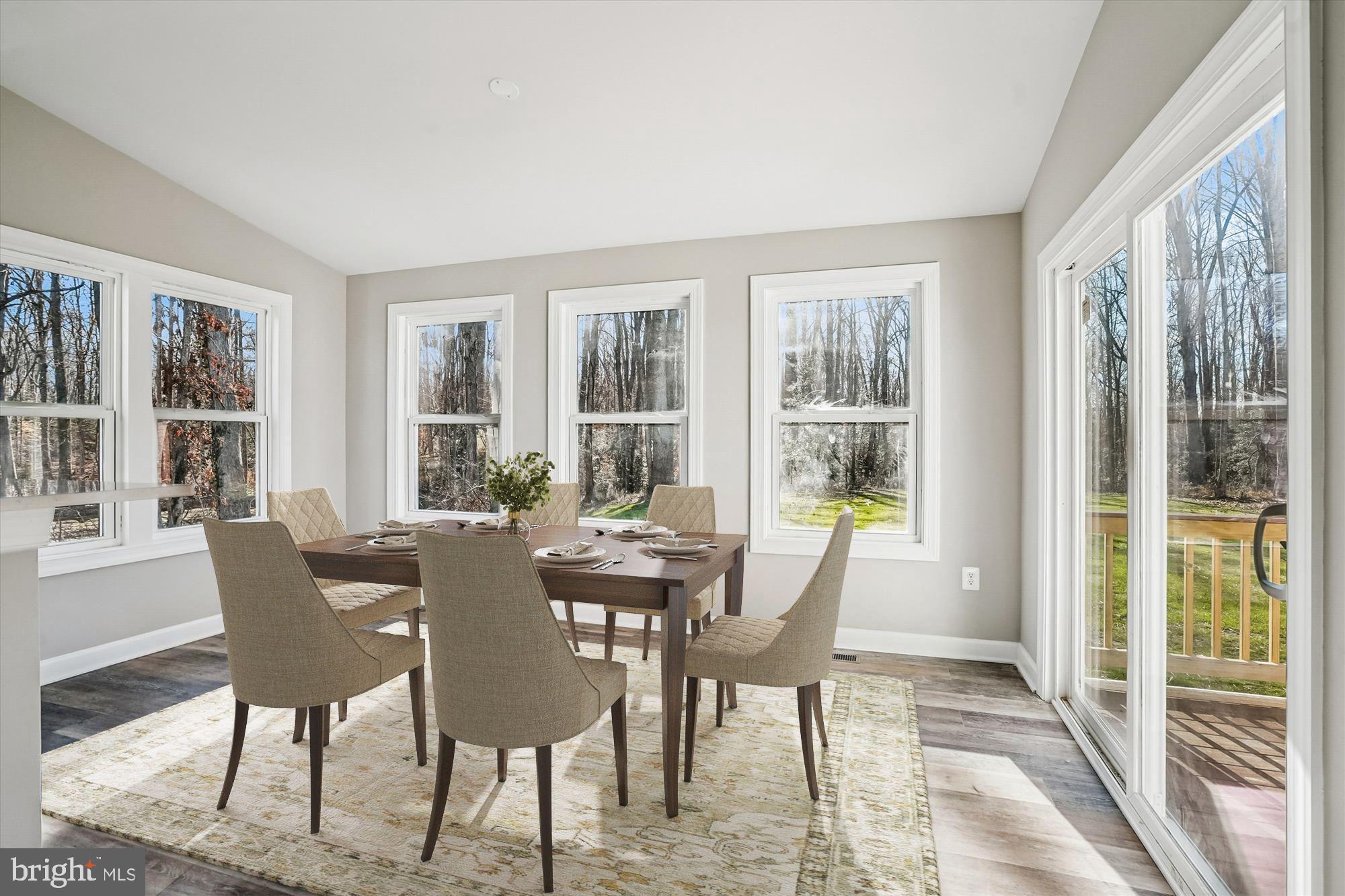 292 Colebrook Road Fredericksburg, VA 22405 - Photo 20 of 67 a view of a dining room with furniture large windows and wooden floor