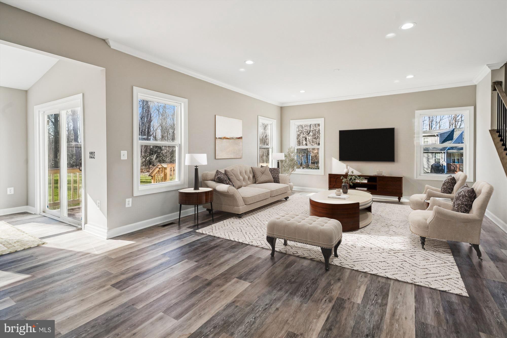 292 Colebrook Road Fredericksburg, VA 22405 - Photo 2 of 67 a living room with furniture flat screen tv and wooden floor