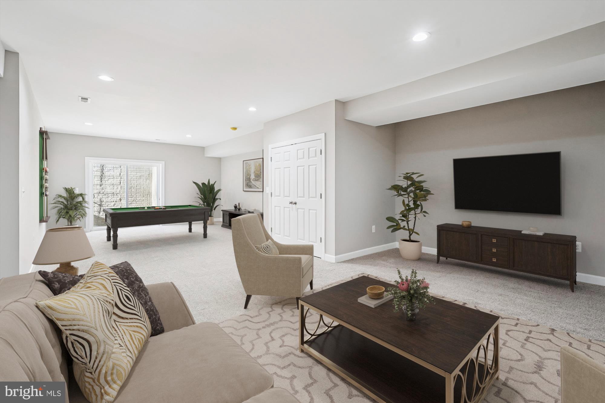 292 Colebrook Road Fredericksburg, VA 22405 - Photo 43 of 67 a living room with furniture a flat screen tv and a table