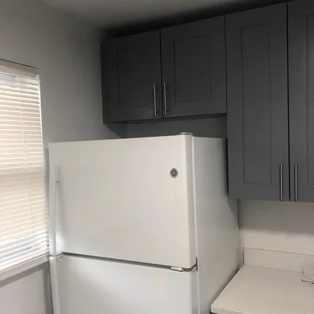 a white refrigerator freezer sitting in a kitchen