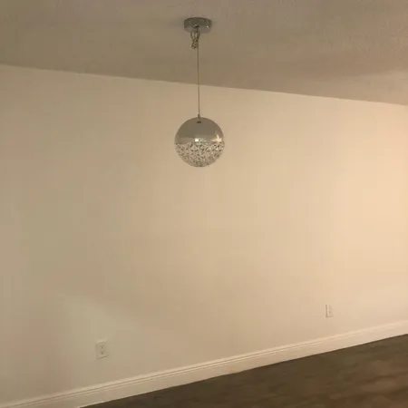 a room with a fan and a window