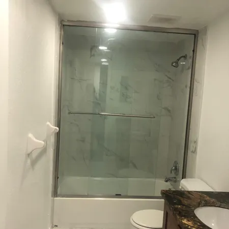 a bathroom with a shower and a toilet