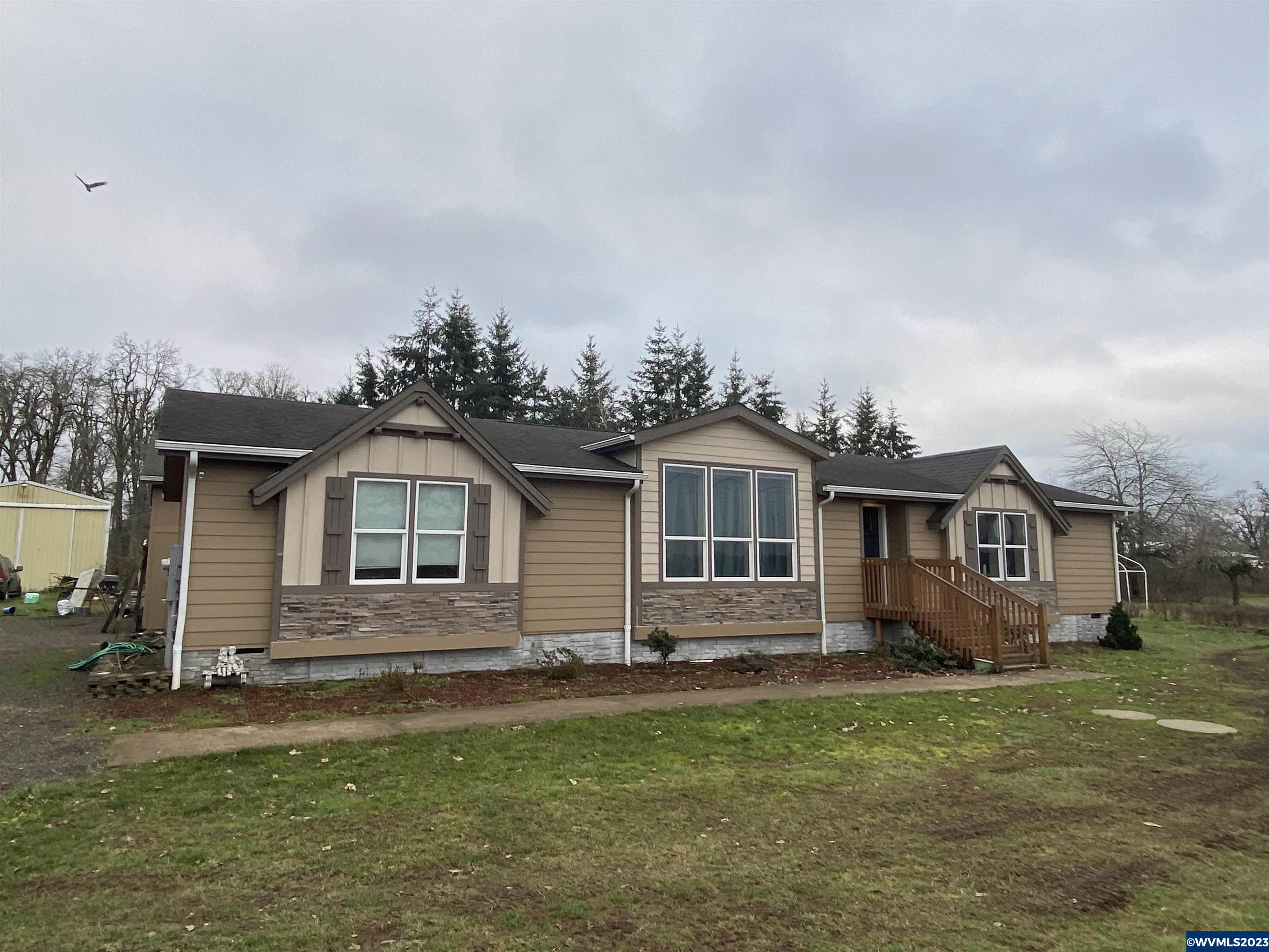 6120 Little Road Southeast Turner, OR 97392 - Photo 20 of 21 a front view of a house with a garden