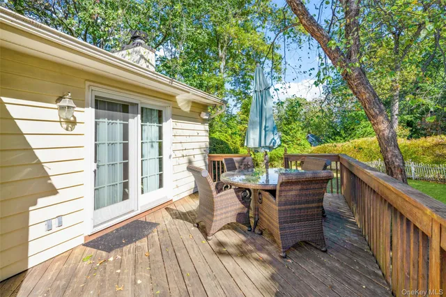 a view of balcony with furniture and wooden deck