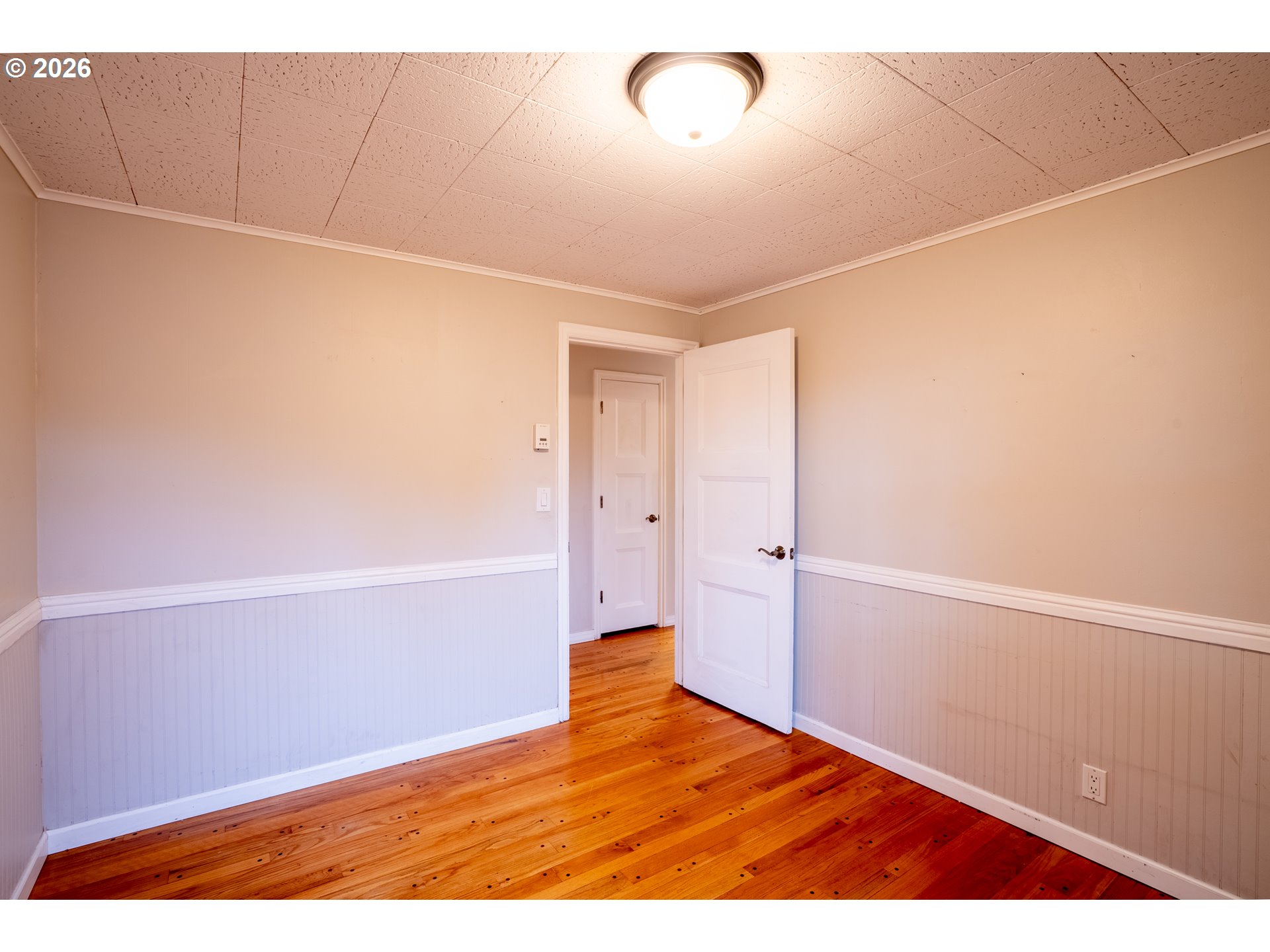 825 Filbert Avenue Eugene, OR 97404 - Photo 11 of 35 a view of an empty room with wooden floor