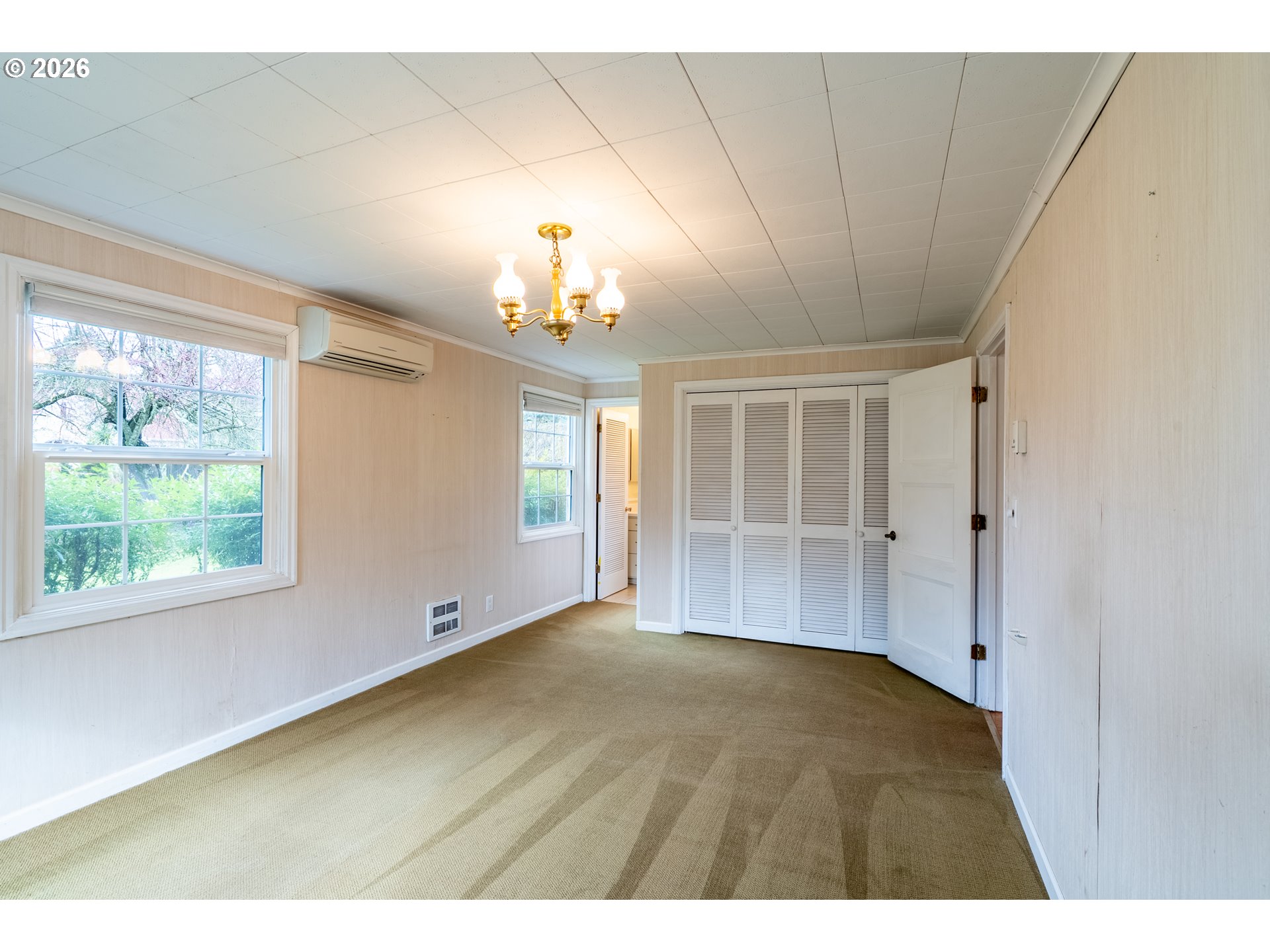 825 Filbert Avenue Eugene, OR 97404 - Photo 15 of 35 a view of empty room with wooden floor and fan