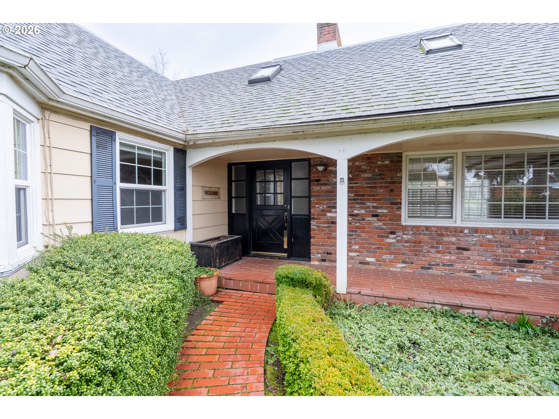 825 Filbert Avenue Eugene, OR 97404 - Photo 2 of 35 front view of a brick house with a yard