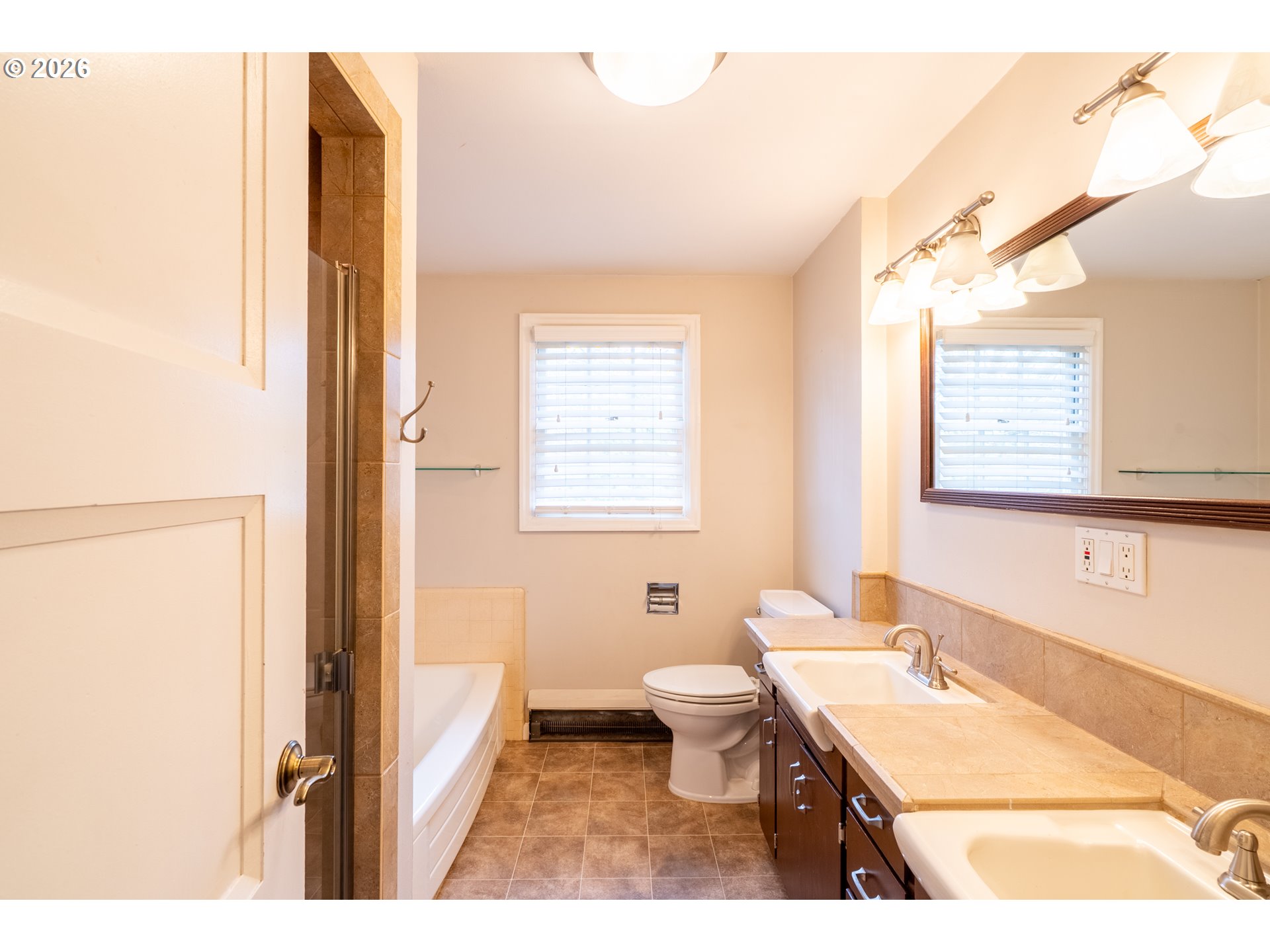 825 Filbert Avenue Eugene, OR 97404 - Photo 21 of 35 a bathroom with a granite countertop sink toilet a mirror and shower