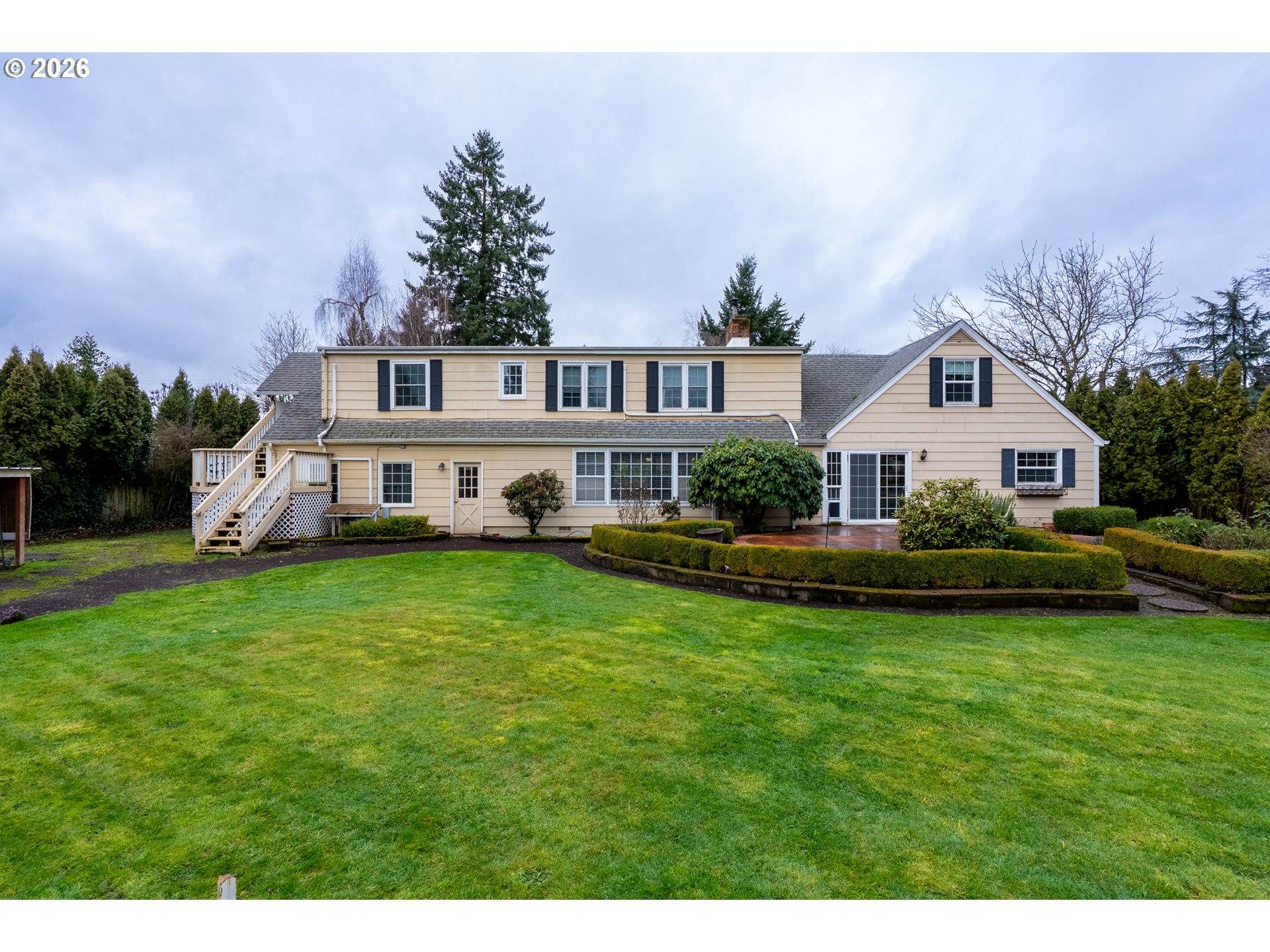 825 Filbert Avenue Eugene, OR 97404 - Photo 30 of 35 a front view of a house with a garden and yard
