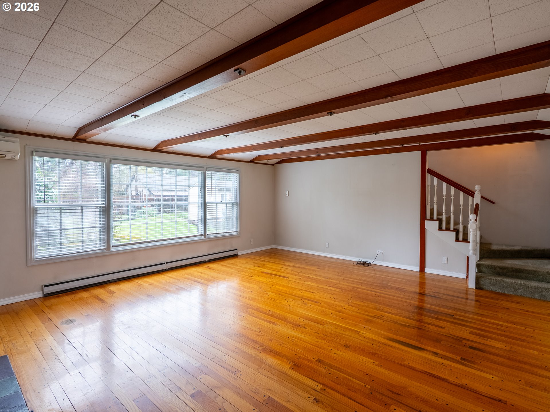 825 Filbert Avenue Eugene, OR 97404 - Photo 6 of 35 a view of empty room with wooden floor and fan