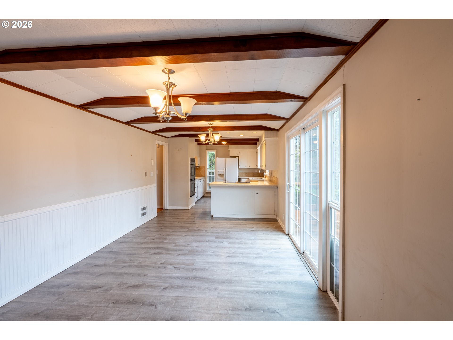 825 Filbert Avenue Eugene, OR 97404 - Photo 9 of 35 a view of a hallway with wooden floor