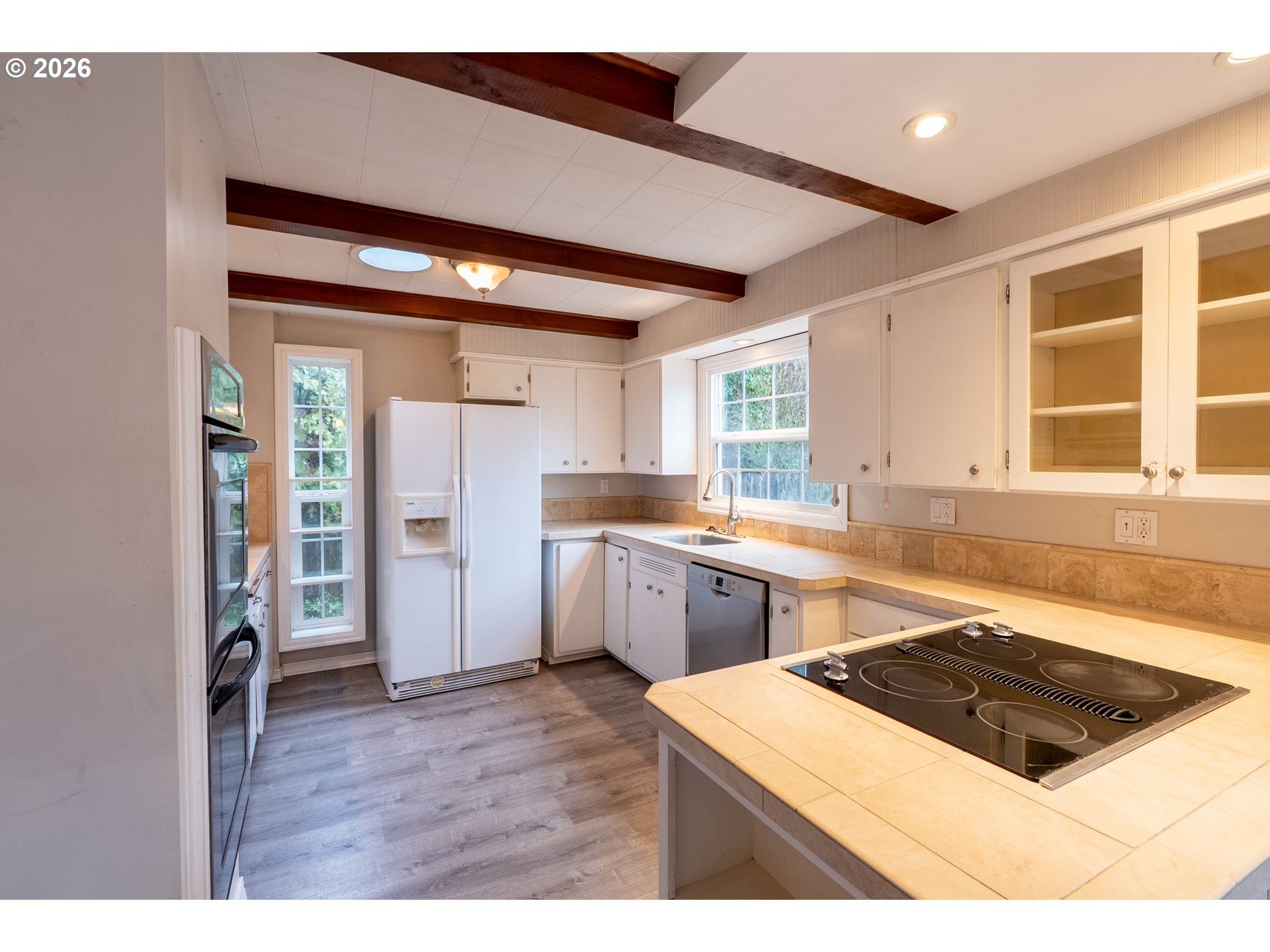 825 Filbert Avenue Eugene, OR 97404 - Photo 10 of 35 a kitchen with a stove a sink and a refrigerator