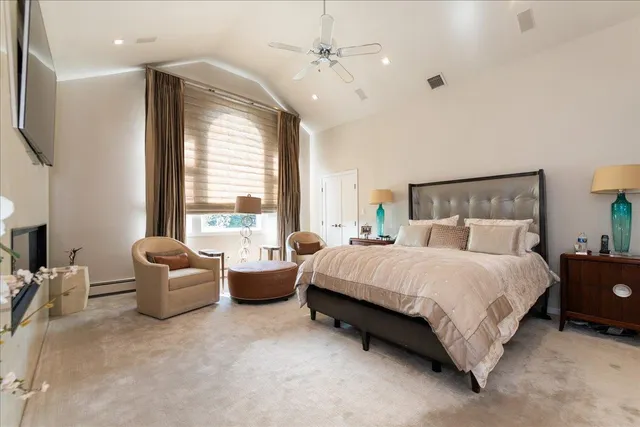 a spacious bedroom with a bed and a couch