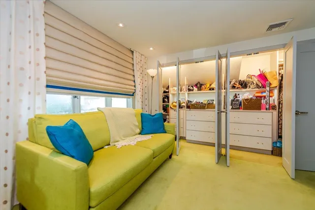 a bed room with bed and window