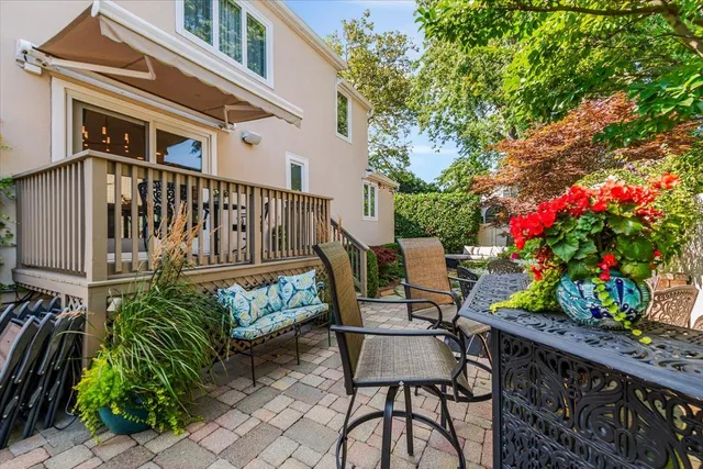 a view of a chairs and table in the balcony