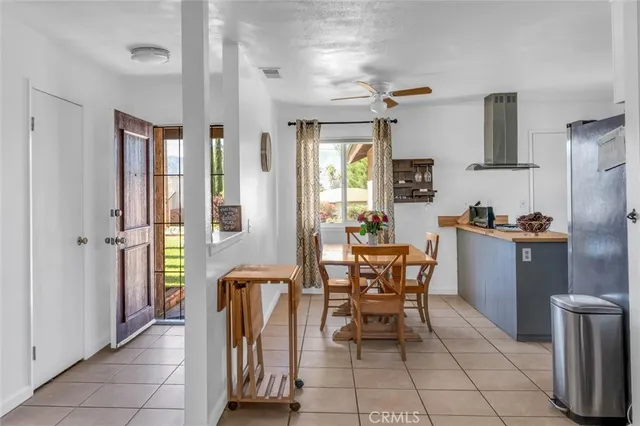 a dining hall with a dining table and chairs