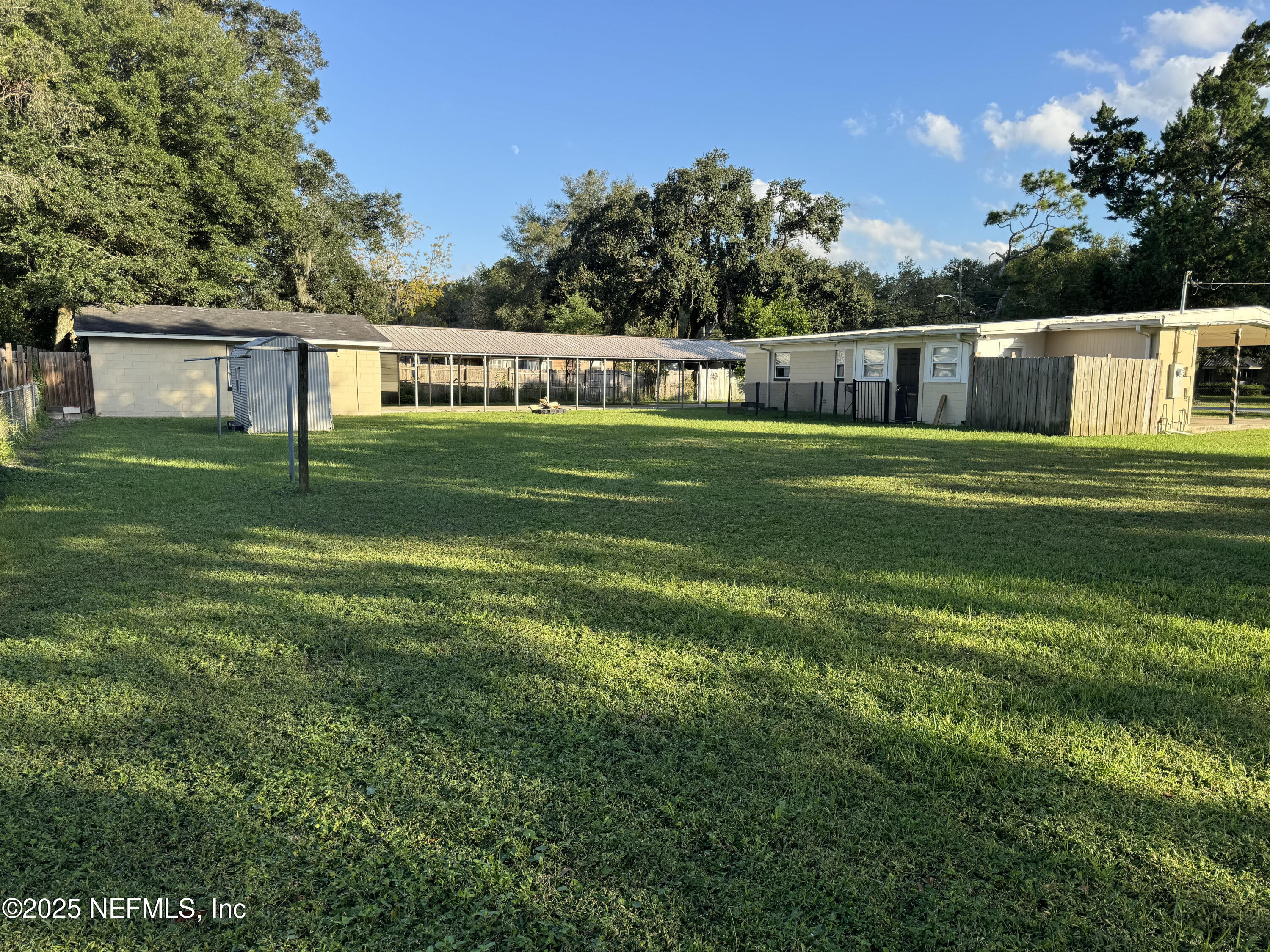 9359 Orme Road Jacksonville, FL 32220 - Photo 5 of 9 a front view of a house with a yard and trees