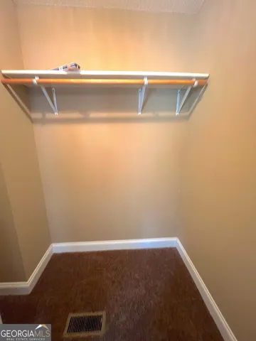 a view of small space with washing machine