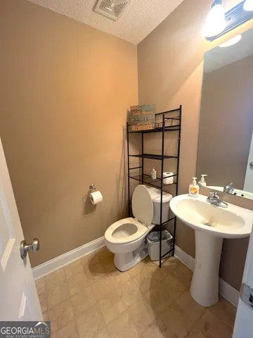 a bathroom with a sink and a toilet