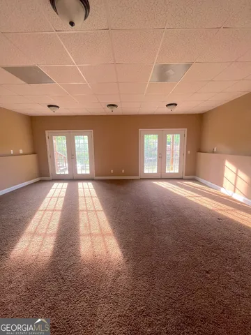 a view of a room with large windows