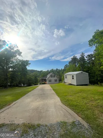 a view of a big yard with palm trees